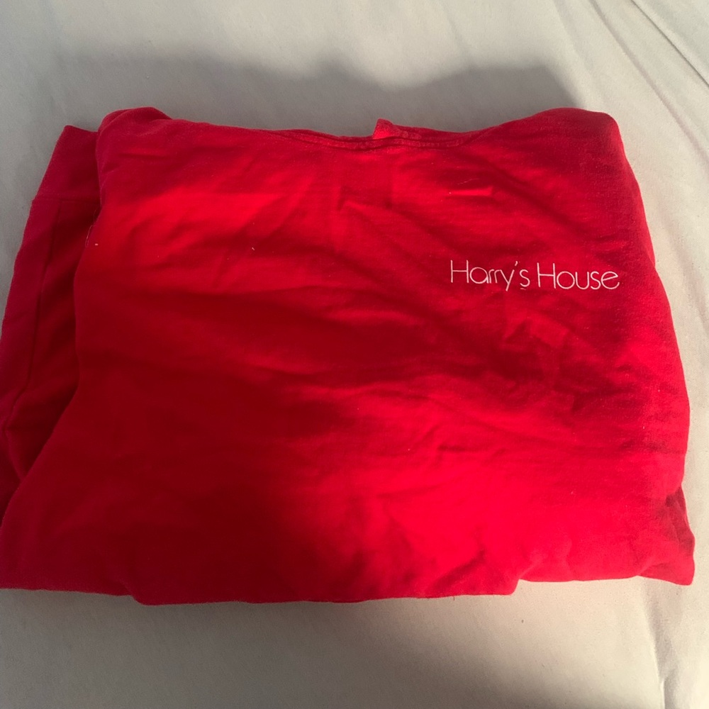 Harry’s House album red sweatshirt, slightly worn